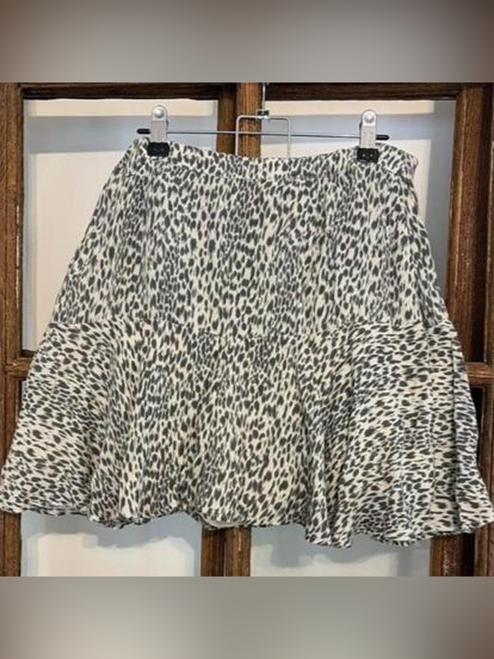 AllSaints leopard print mini skirt with ruffles.